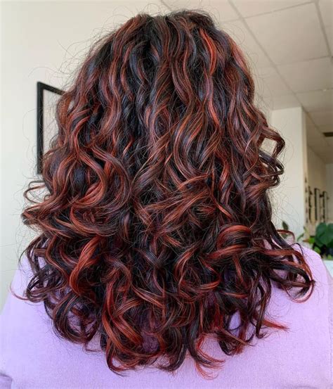 dark red highlights curly hair|medium red hair with highlights.